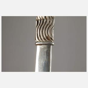 Acht figürliche Brieföffner