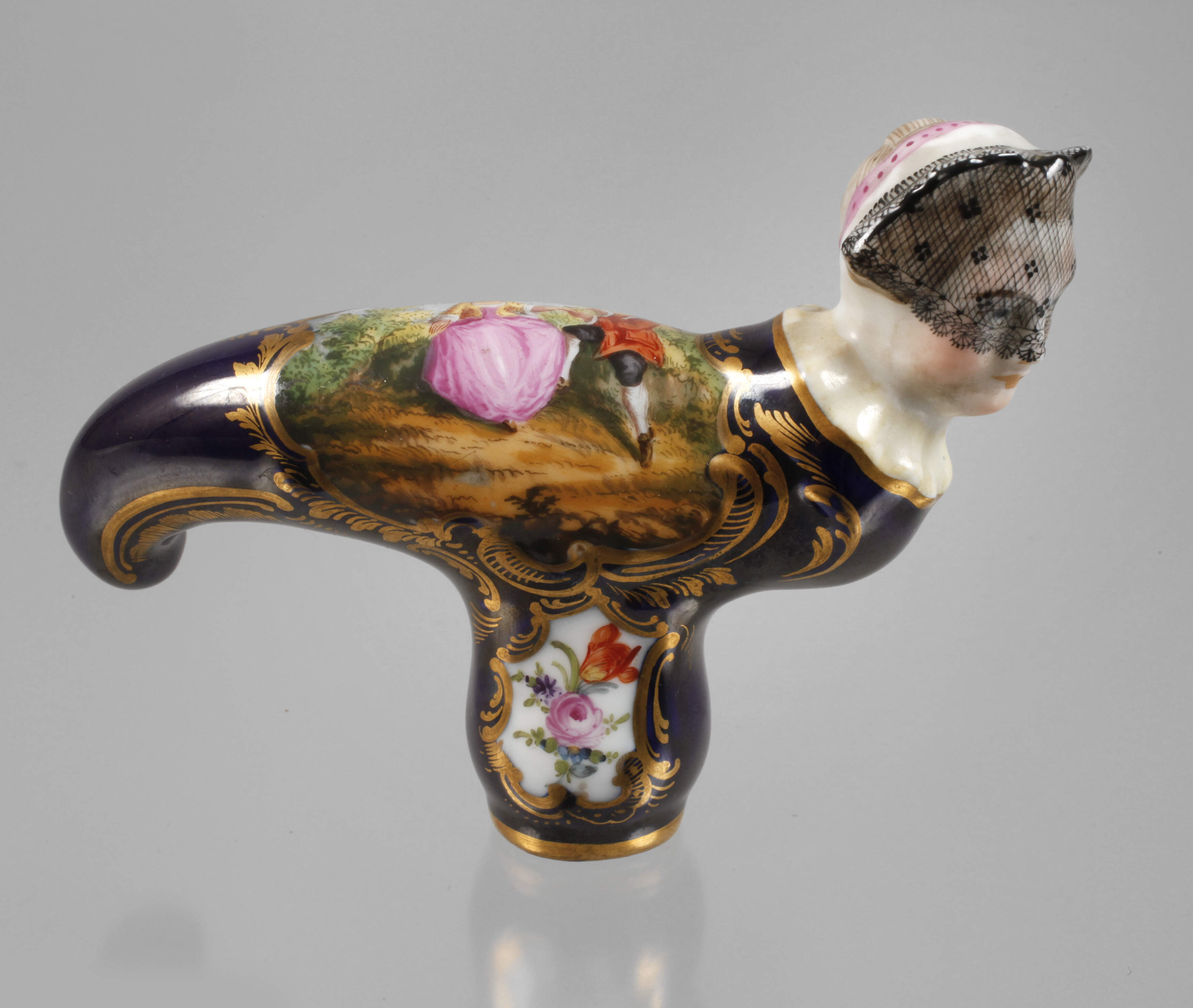 Stockgriff mit Frauenkopf und Watteauszene