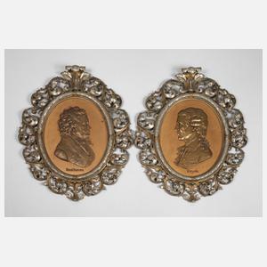 Paar große Eisengussreliefs