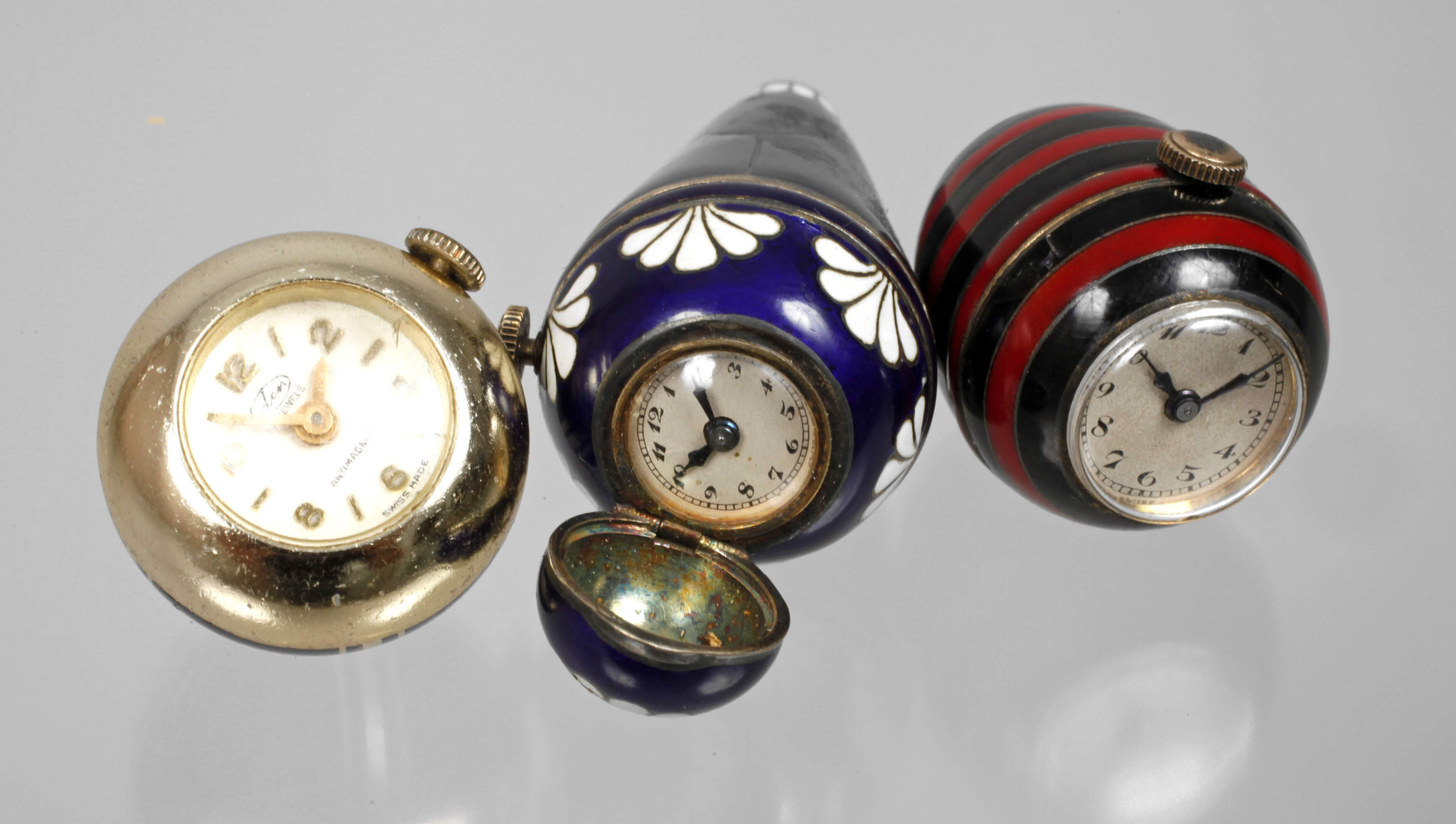 Drei Schmuckuhren Emaille
