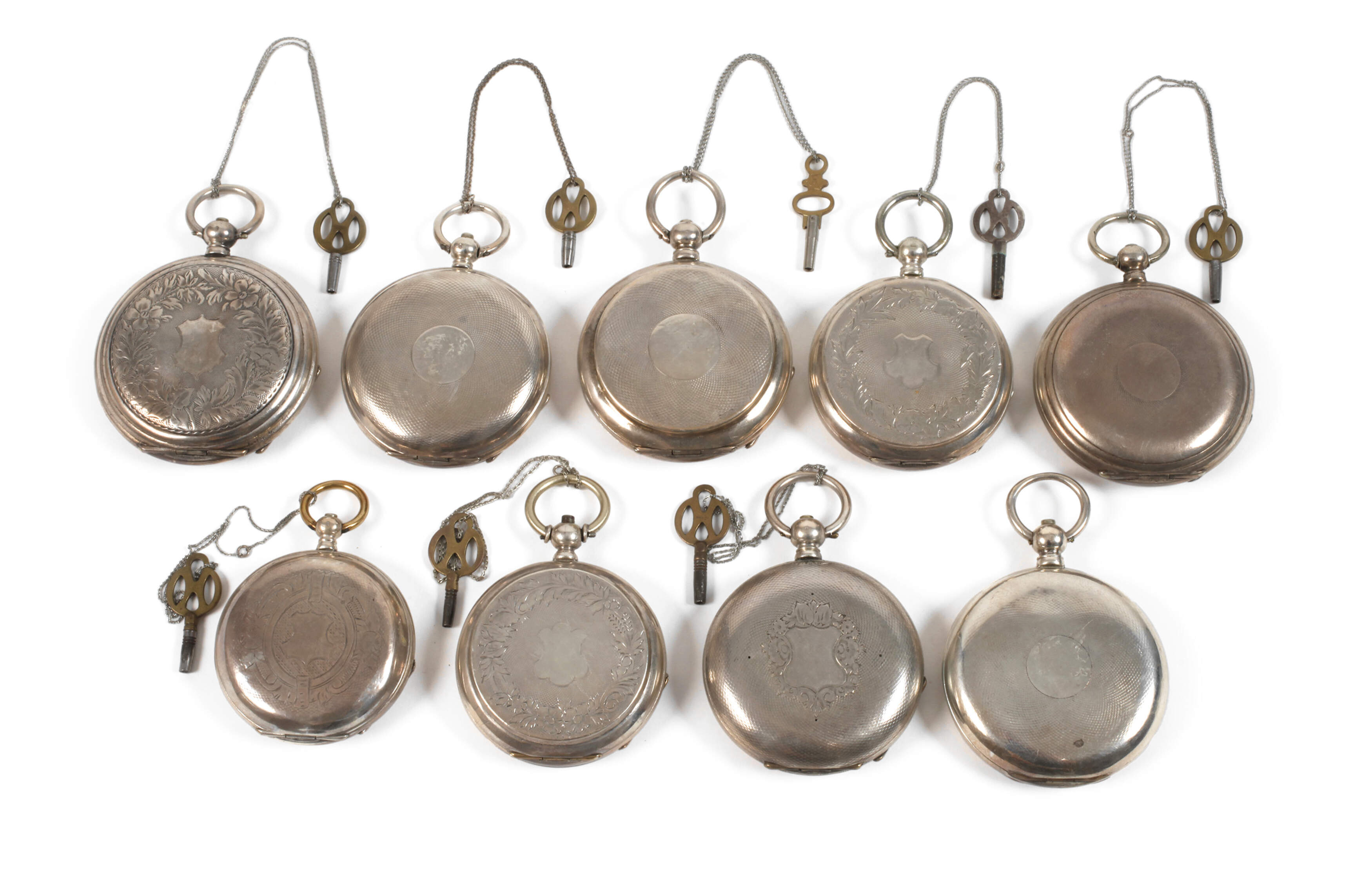 Neun Schlüsseluhren Silber
