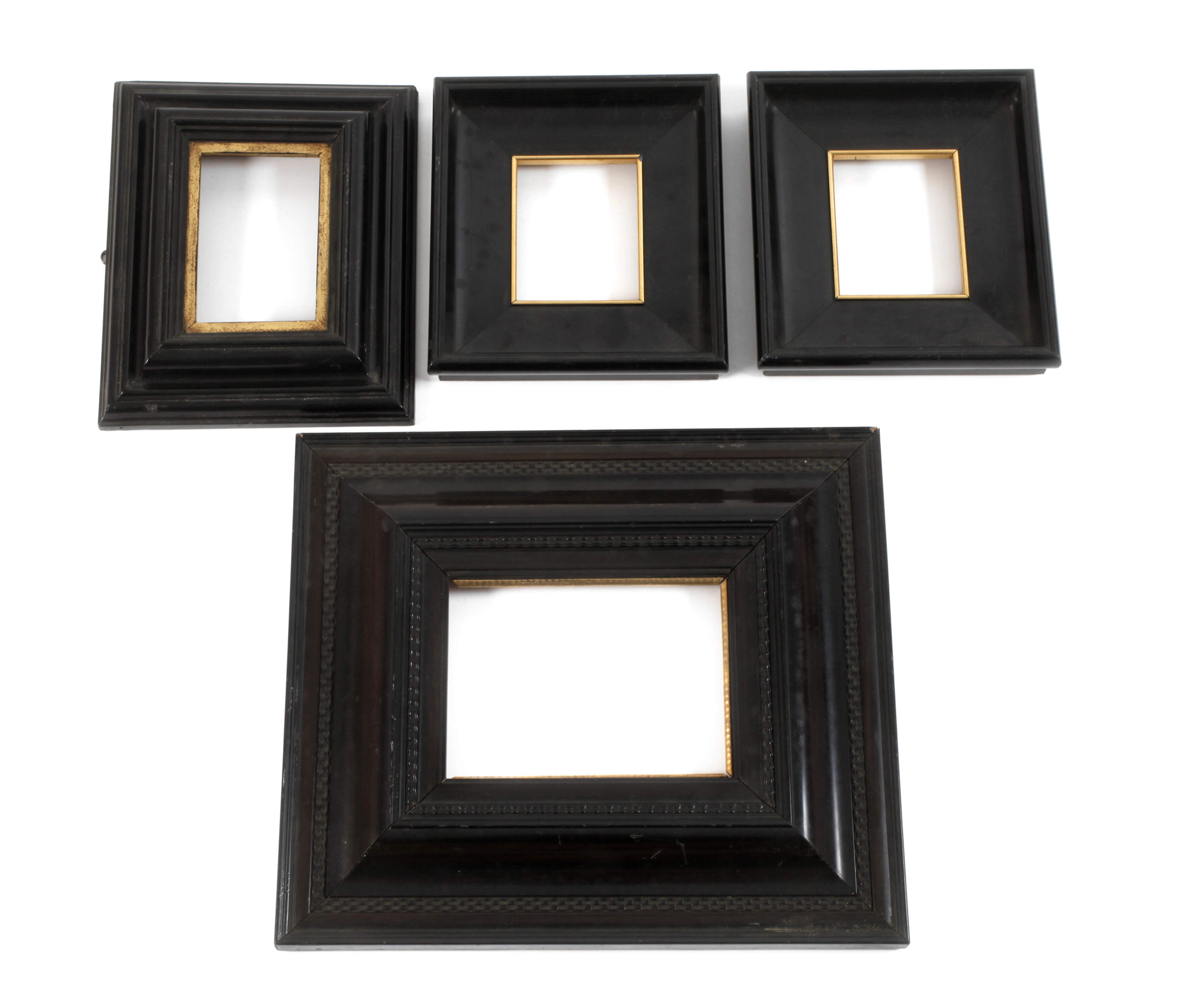 Vier kleine Lackleisten