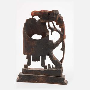 Drei geschnitzte Uhrenständer