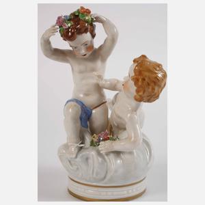 Paar figürliche Leuchter und Puttengruppe