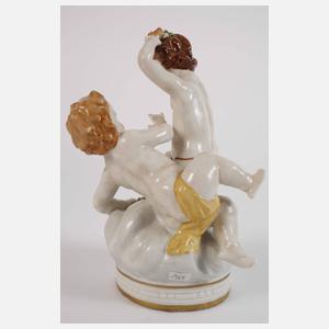 Paar figürliche Leuchter und Puttengruppe