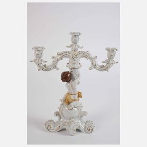 Paar figürliche Leuchter und Puttengruppe