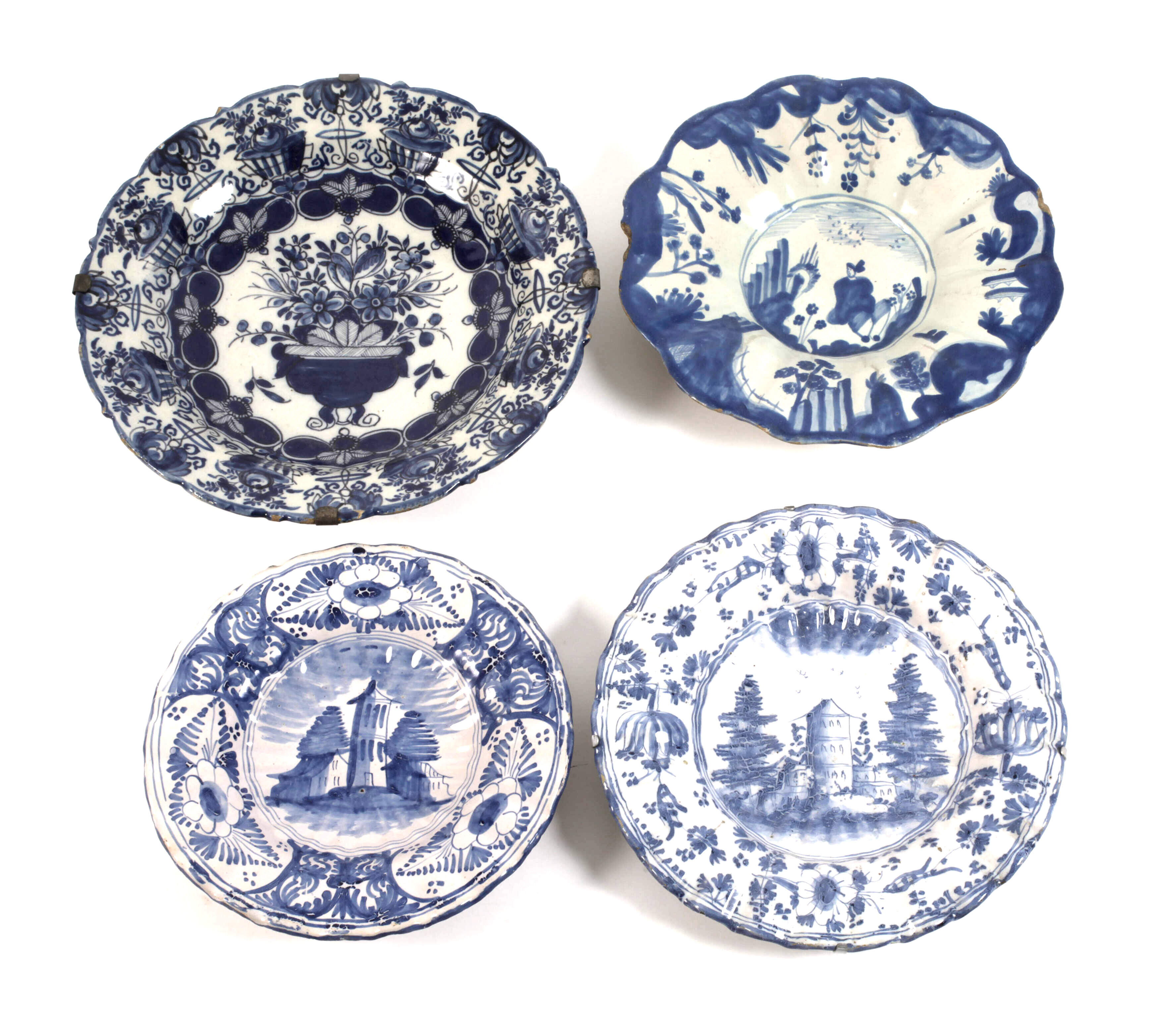 Vier Fayenceteller Blaumalerei