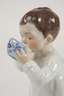 Meissen ”Kind, aus einer Tasse trinkend”