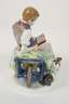 Meissen "Knabe auf Schiebebock"