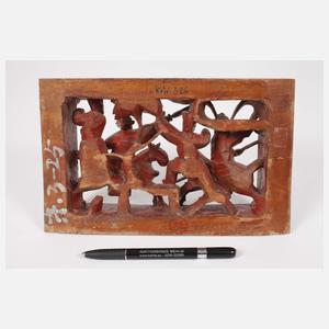 Drei Reliefschnitzereien