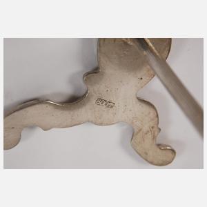 Zwölf Messerbänkchen im Rokokostil