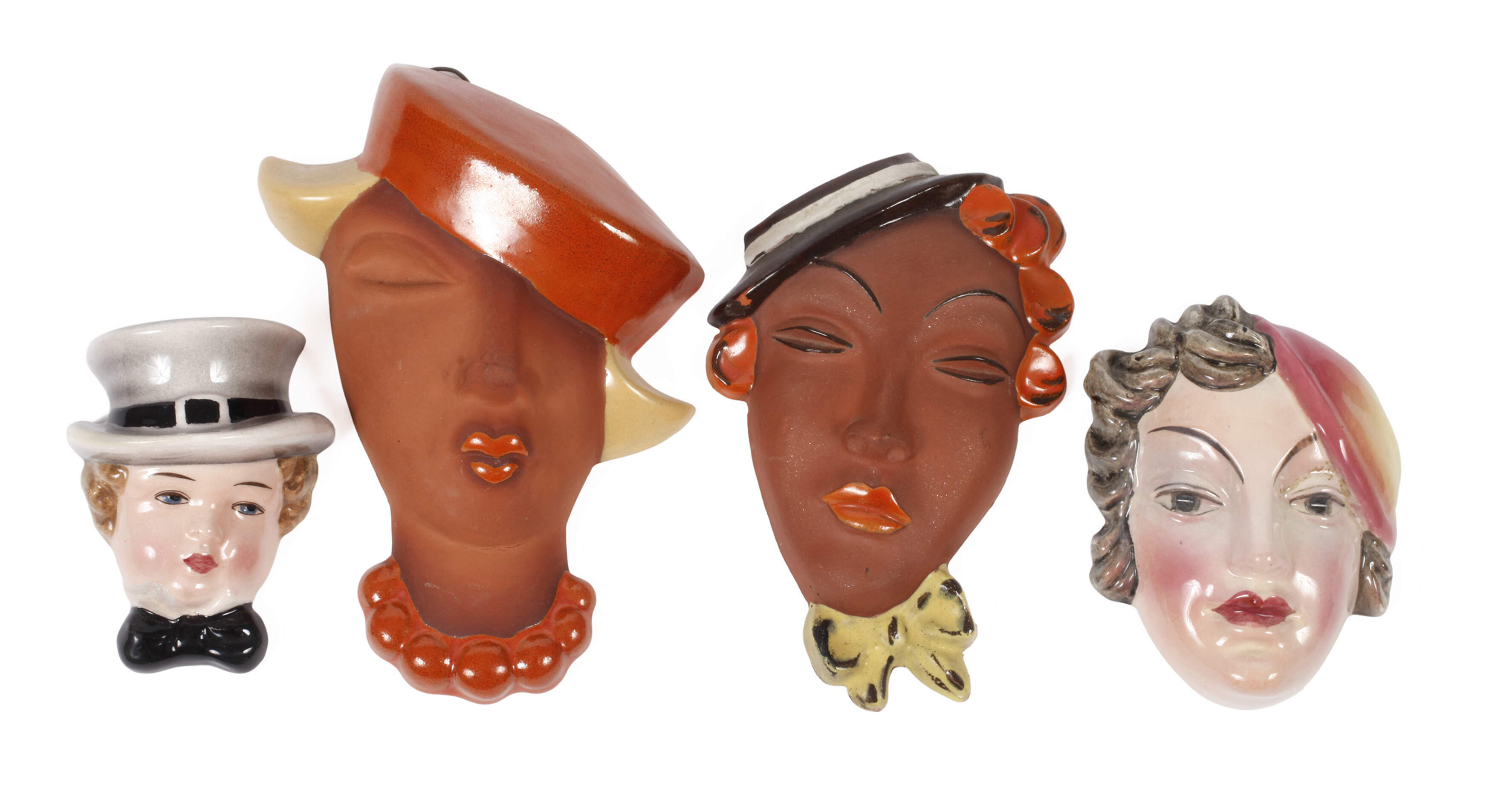 Vier kleine Wandmasken Art déco