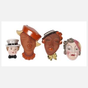 Vier kleine Wandmasken Art déco