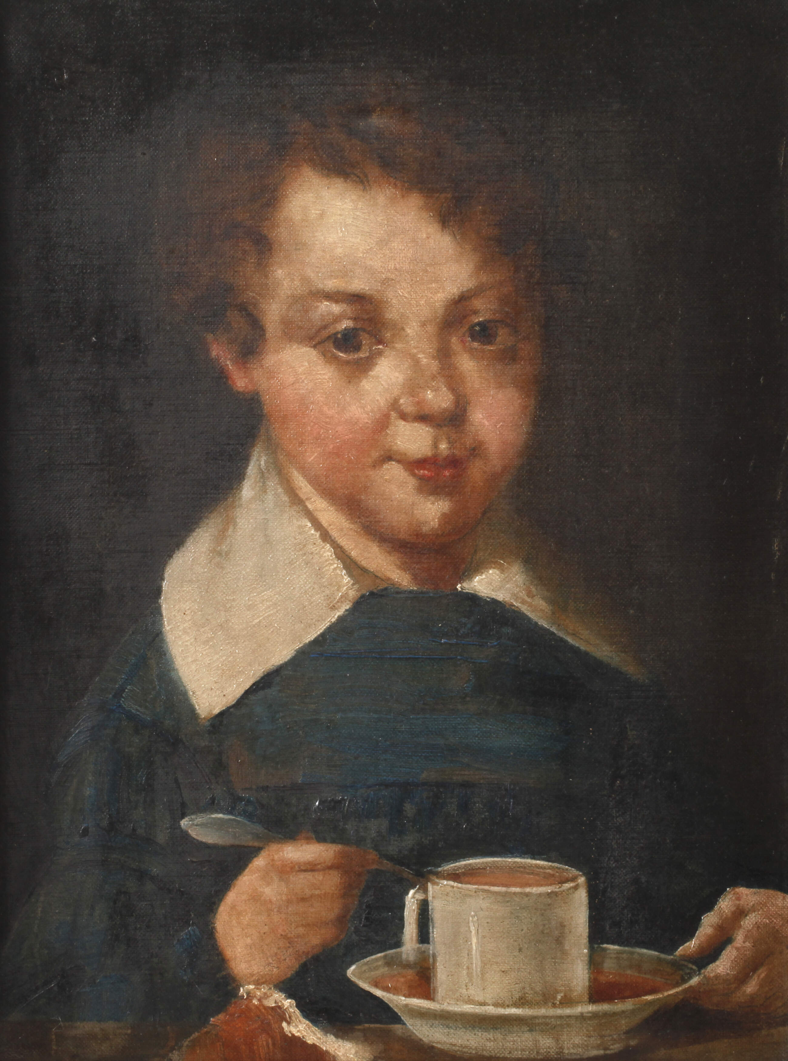 Kind mit Kakaotasse