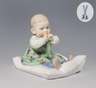 Meissen, Jugendstil-Figur "Kind, auf einem Kissen sitzend"