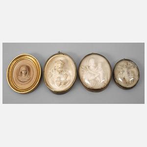 Vier Meerschaumschnitzereien