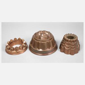 Drei Kupferbackformen