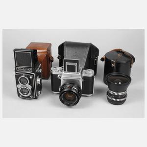 Zwei Fotoapparate und Objektiv