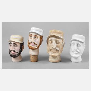 Vier figürliche Flaschenstopfen