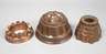 Drei Kupferbackformen