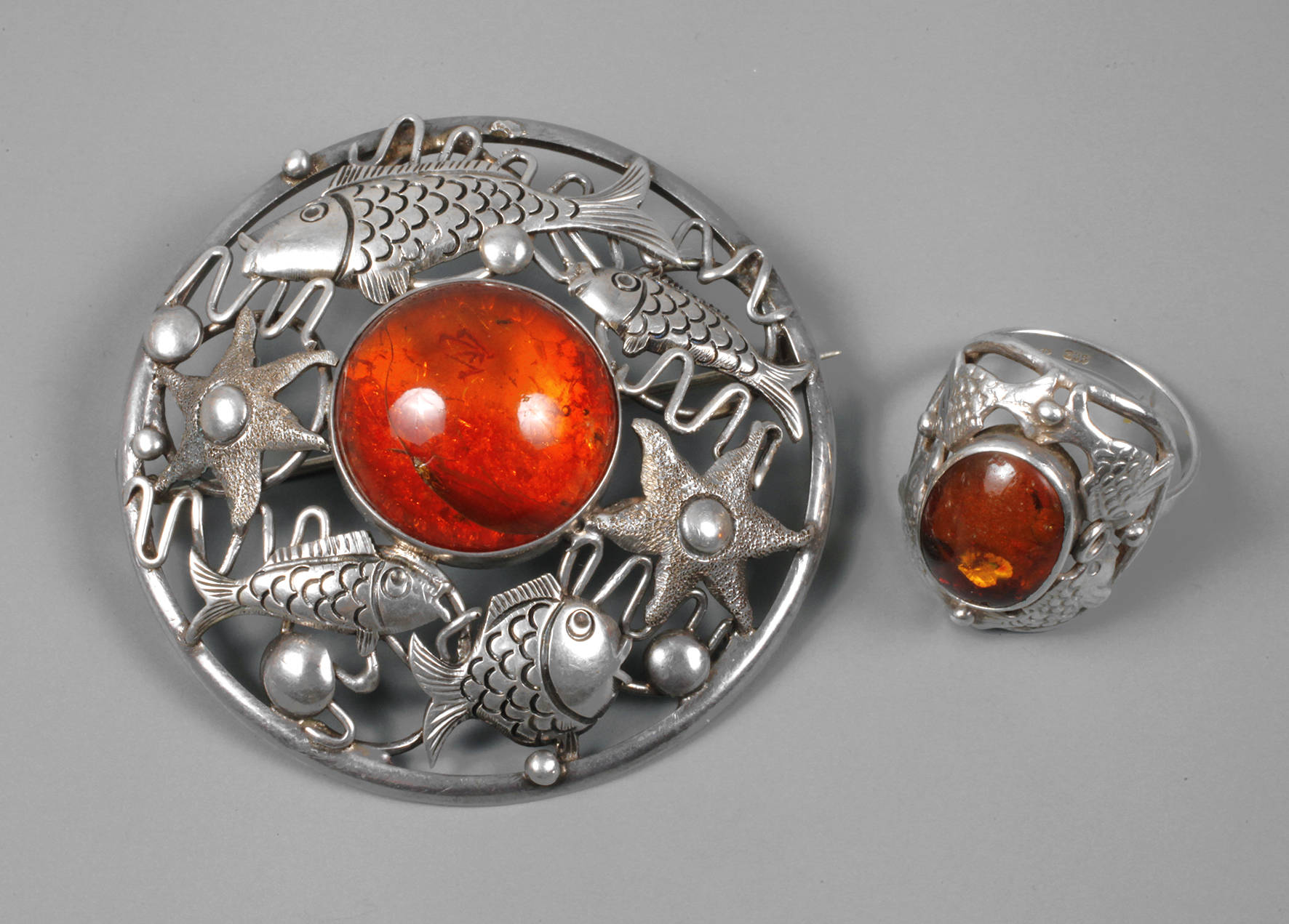 Brosche und Damenring Bernstein