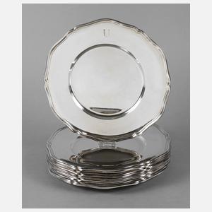 Zwölf große Platzteller Silber