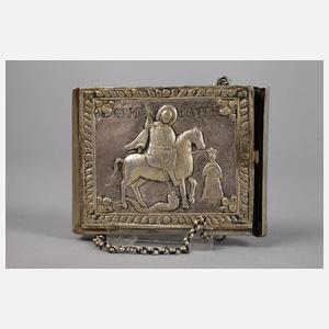 Silberetui und Kruzifix