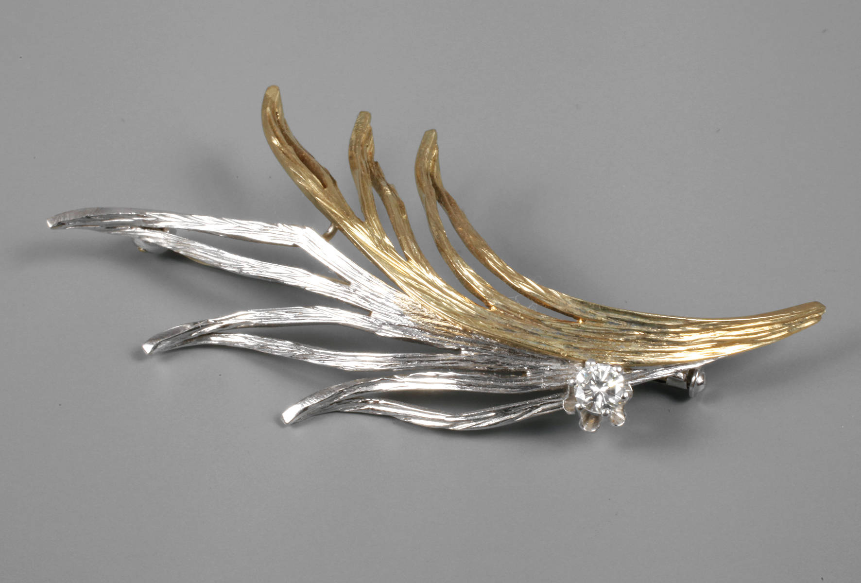 Goldbrosche mit Brillant