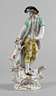 Meissen Figurengruppe, blaue Schwertermarke nach 1934, zwei Mal gestrichen, verschiedene Präge- und Pinselnummern, feine polychrome Bemalung und Vergoldung, Schäfer mit Hund und Schaf, auf einem rocaillenverzierten Sockel stehend und den Hund füttern
