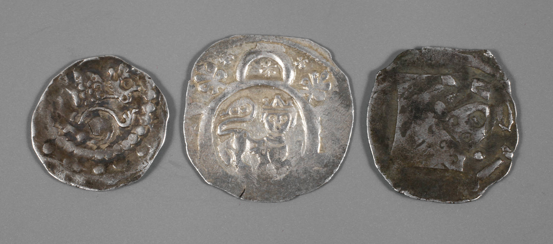 Pfennig und zwei Brakteaten