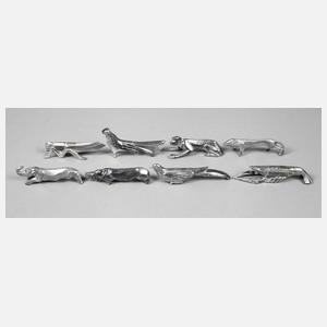 Acht Messerbänkchen