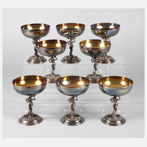 Acht Eisschalen mit figürlichem Schaft