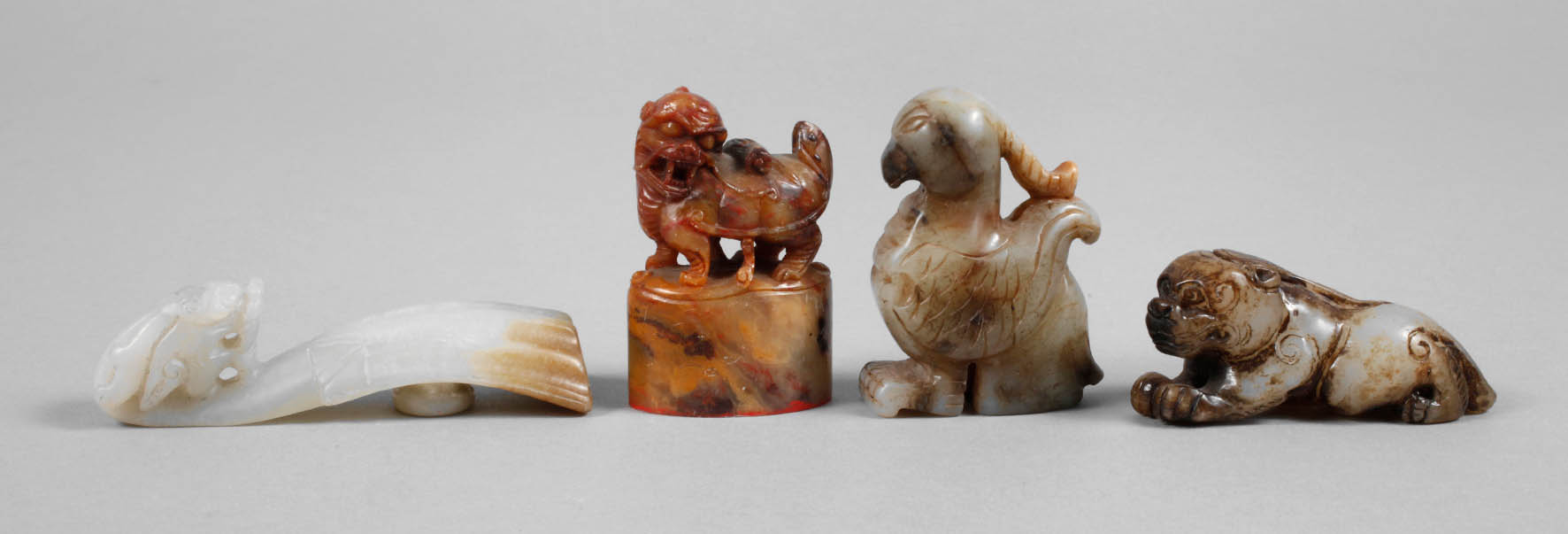 Vier Speckstein-Schnitzereien