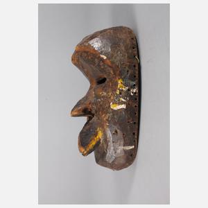 Kleine Gesichtermaske