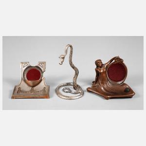 Drei Taschenuhrenhalter