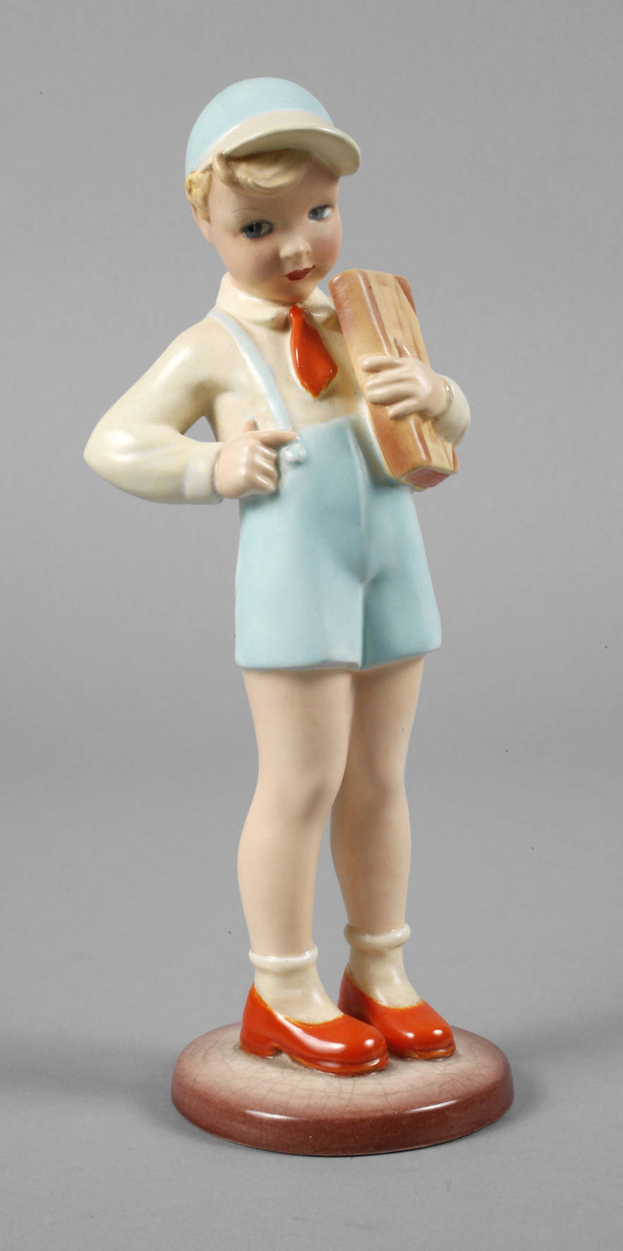 Keramos Wien Schulbub mit Buch