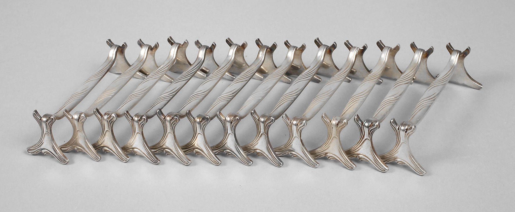 Christofle zwölf Messerbänkchen