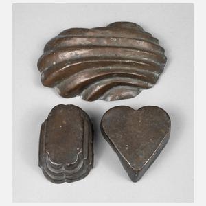 Drei kleine Kupfermodel