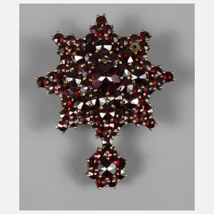 Sternförmige Brosche mit Granatbesatz
