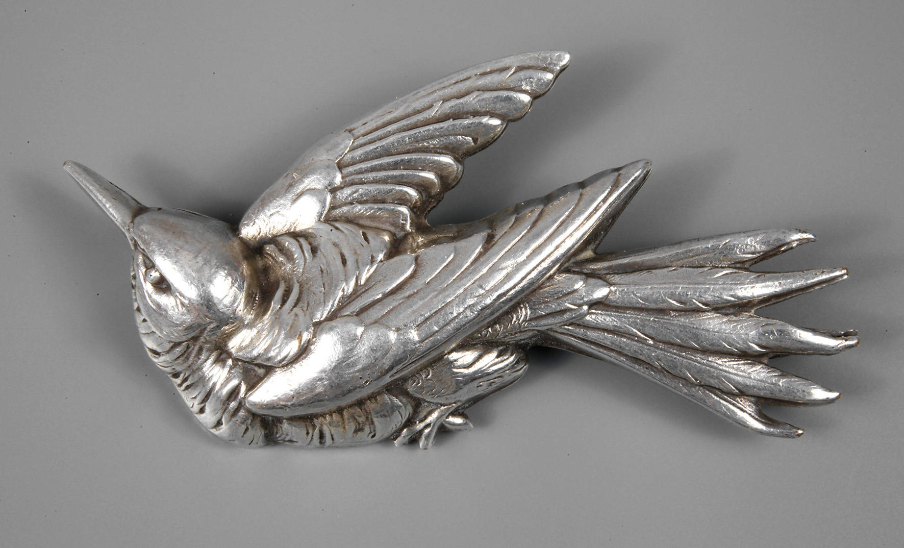 Brosche als fliegender Vogel