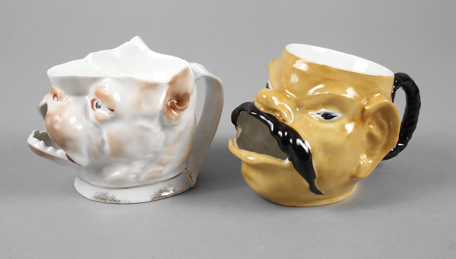 Hof-Moschendorf zwei figürliche Rasierbecher