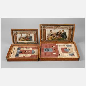 Zwei Anker-Steinbaukästen