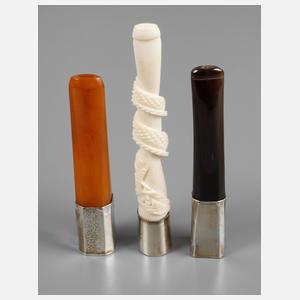 Drei Zigarettenspitzen