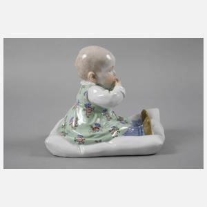 Meissen ”Kind, auf einem Kissen sitzend”