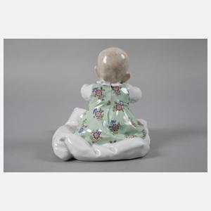 Meissen ”Kind, auf einem Kissen sitzend”
