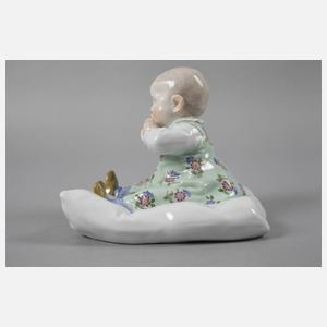 Meissen ”Kind, auf einem Kissen sitzend”