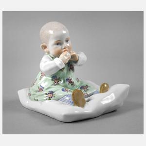 Meissen ”Kind, auf einem Kissen sitzend”