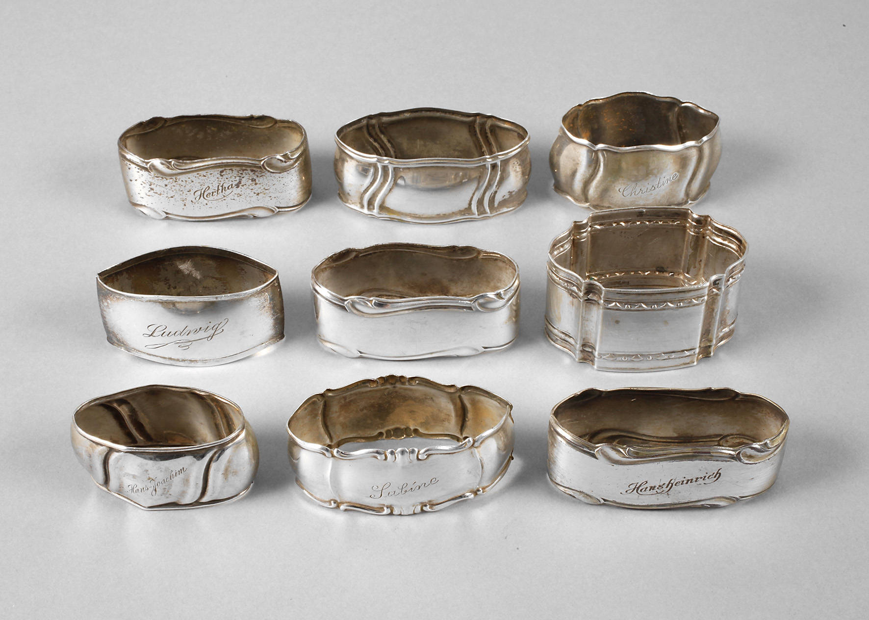 Neun Serviettenringe Silber