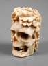 Geschnitzter Totenkopf Bein