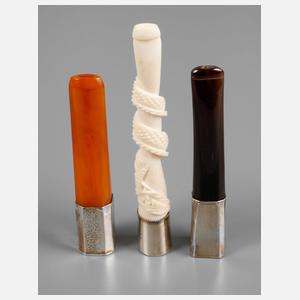 Drei Zigarettenspitzen